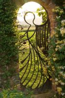 The angel gate in the walled garden looking over the Malvern Hills. Gate made by Mike Roberts