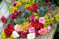 Cottage garden favourites in a bouquet. Love-in-a-mist - Nigella damascena, pinks - Dianthus, perennial wallflower - Erysimum 'Bowle's Mauve', lavender - Lavandula and lady's mantle - Alchemilla mollis