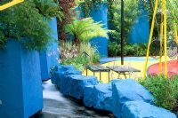 Vivid blue walls and rocks with seating and Cycas revoluta, Hosta, Acer japonicum and Gunnera manicata. Citroen UK's 'Citroen in Bloom' - Hampton Court