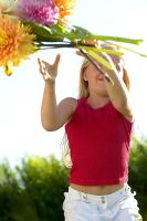 Girl throwing bunch flowers 