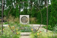 Moongate, Stipa tenuissima, Stipa gigantea, Anthriscus sylvestris 'Ravenswing' and Iris - The Laurent Perrier Garden, Chelsea 2007