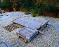 Roof garden with bamboo lounger and table