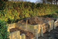 Compost bins constucted from breeze blocks and wooden shuttering at Old Rectory, Sudborough, Northants 