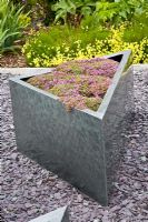 Contemporary triangular metal planter 