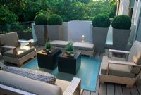 Contemporary decked balcony with seats and Buxus spheres in containers - Kensington, London