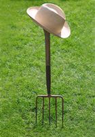 Hat on fork stuck in lawn
