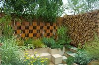 Chequered screens with trees and seating area - The Pemberton Greenish Recess Garden, RHS Chelsea Flower Show 2008