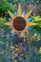 Sun ornament and mixed planting - From Life to Life, A Garden for George, RHS Chelsea Flower Show 2008