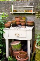 Rustic potting bench in walled garden