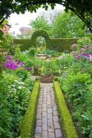 The Garden at Dial Park, Worcestershire -Planting includes box and yew hedges and Alliums