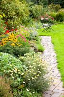 Mixed border edged with brick pathway