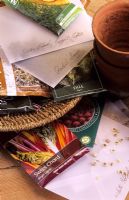Selection of garden seed packets on potting bench