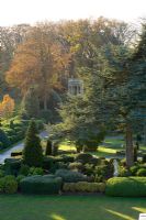 View of lawn, monkey puzzle tree and evergreen topiary borders from the roof of the hall - Brodsworth Hall, Yorkshire