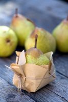 Comice Pears wrapped in brown paper for protection in storage