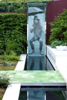 Photograph of George Harrison beside water feature - From Life to Life, A Garden for George, RHS Chelsea Flower Show 2008 
