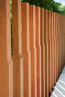 Shaped vertical timber fence posts in The Marshalls Living Street Garden, sponsored by Marshalls plc - Silver-Gilt Flora medal winner at RHS Chelsea Flower Show 2009