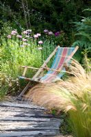 Deck chair in coastal-look garden