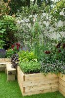 Wooden raised bed planted with Dahlias, Salvia, Herbs and Lettuce
The 'Hope Begins at Home' at RHS Hampton Court Palace Flower Show 2009
Design Boardman Gelly Hope Begins at Home