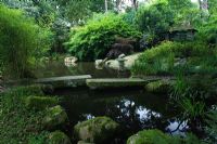 Pine Lodge Gardens - St Austell - Cornwall - The Japanese Garden - Showing the stone bridge across the lake