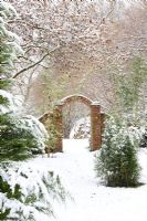 Brick archway in snow at Honeybrook House Cottage, Worcestershire