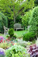 Eastgrove Cottage garden - View from 'Great Wall of China' border to garden benches
