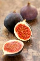 Sliced fresh fig on a wooden table