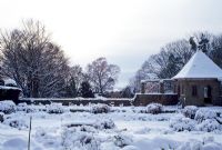 Wyndcliffe Court, St Arvans, Monmouthshire under snow in December. View across sunken garden and summerhouse