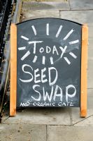 Bill board advestising a Seed Swap and Organic Cafe
