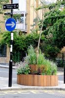 Smart wooden street planter used as part of a road closure scheme, Highbury, London, England, UK