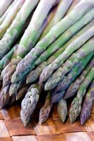 Asparagus spears in a wooden bowl