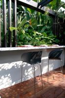 Built in bar and entertaining area in tropical garden. Trailfinders Australian Garden, Gold medal winner, RHS Chelsea Flower Show 2010 