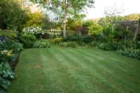 Landscaped raised lawn with early summer border - Old Buckhurst, Kent