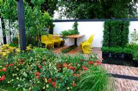 Outdoor dining table planted with Strawberries in the centre with lemon tree along wall. 'Food 4 Thought' - Gold Medal Winner - RHS Hampton Court Flower Show 2010 
