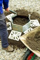 Herb Hexagon - Step 5. Line the sides of the raised bed with black polythene then fill with sandy or gritty soil