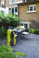 Table set for lunch on slate patio. London