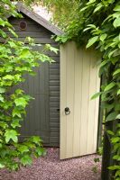 Potting shed tucked away in a corner and door leading into garden in secluded suburban garden - High Trees, Longton, Stoke-on-Trent, Staffordshire, NGS