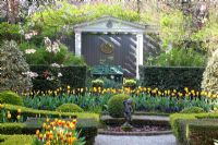 Formal garden with beds of Tulipa 'Washington', Tulipa 'Juliette' and Tulipa 'Mickey Mouse' 