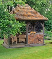 Oak, brick and tile built gazebo in Mrs Ann Lee's garden