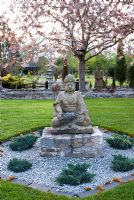 Buddha in newly planted Japanese garden