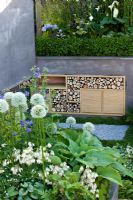 Sunken patio area with built in storage - 'A Joy Forever' Garden, Silver medal winner at RHS Chelsea Flower Show 2010