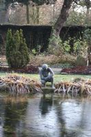 Frozen pond with statue - Trompenburg, Rotterdam, Holland