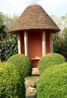Round Summerhouse and clipped Buxus