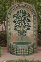 Fountain with mosaic in the Jardin Nectarome organic aromatic garden, Marrakech, Morocco