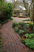 Curved pathway leading to the greenhouse - Pembury House Gardens, Sussex