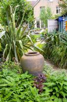 Clay urn used as a focal point - Helen Riches' Garden, Essex 
