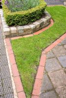 Detail of lawn edging and path made from reclaimed Southport paviours, platform station tiles and red brick, raised bed edged with Buxus - Box hedge and Lavandula - Brocklebank Road, Southport, Lancashire NGS 
