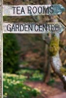 Old Wooden garden centre sign at Batsford Arboretum, Glouchestershire, England
