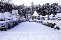 The Bowling Green covered in snow - Arts and Crafts style garden at Wyndcliffe Court, St Arvans, Monmoutshire 