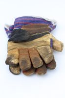 Old pair of worn gardening gloves 