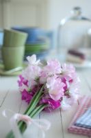 Wooden pained table with bunch of Lathyrus - Sweet Peas